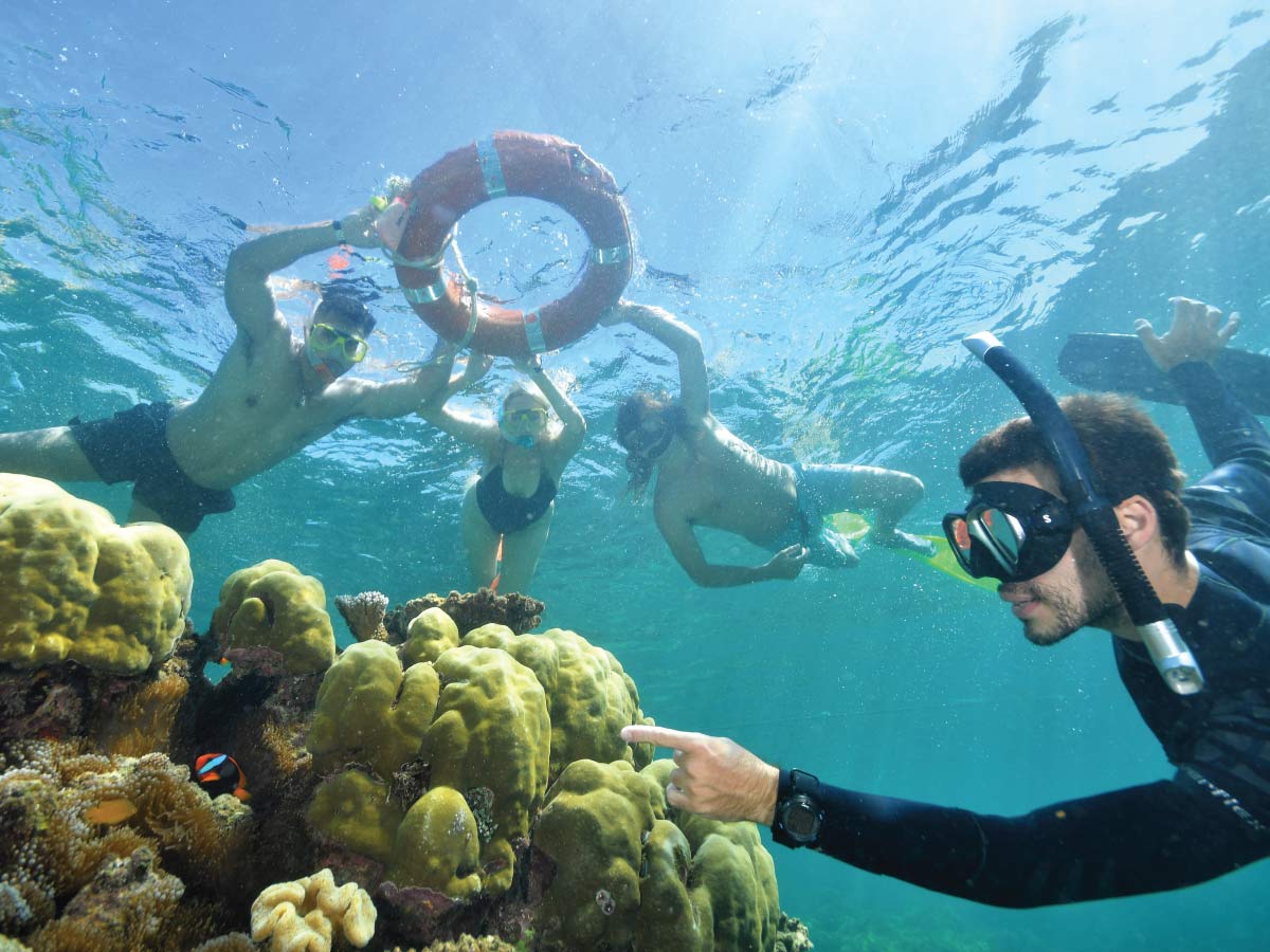 Three women exploring the Great Barrier Reef